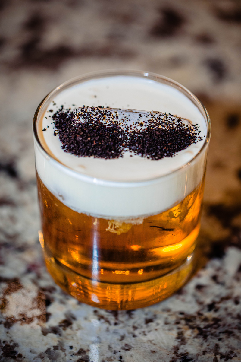 The Ambassador craft cocktail with champagne float